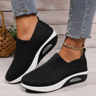 Lova dam sneakers i svart med flexibelt stickat överdel – sidovy