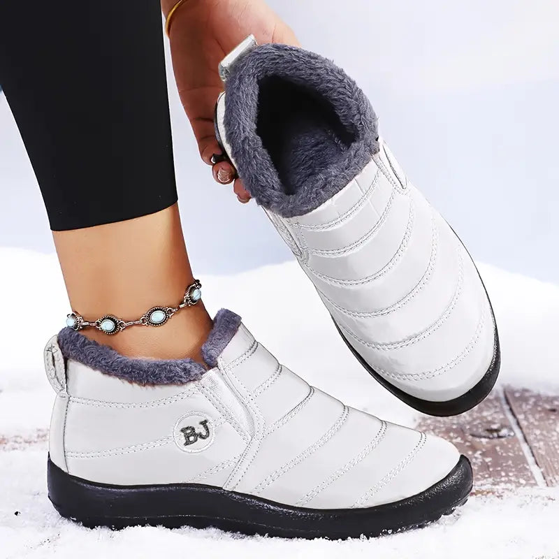 Lila dam vinterboots med slip-on-design och sidoelasticitet